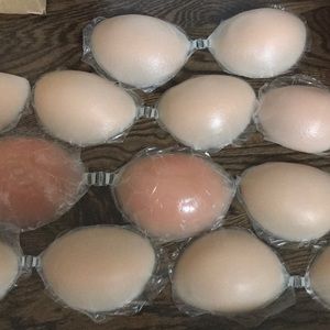 Adhesive silicone bra coverings